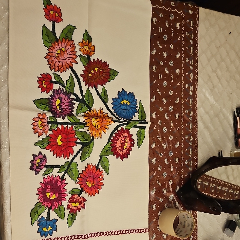 hand-embroidered cover.